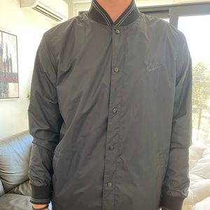 Nike snap up jacket. Never worn!! Too small.